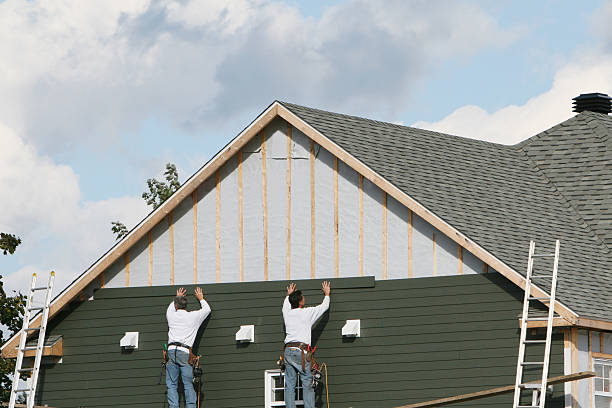 Professional Storm Damage Siding Repair technician working in Lenoir, NC